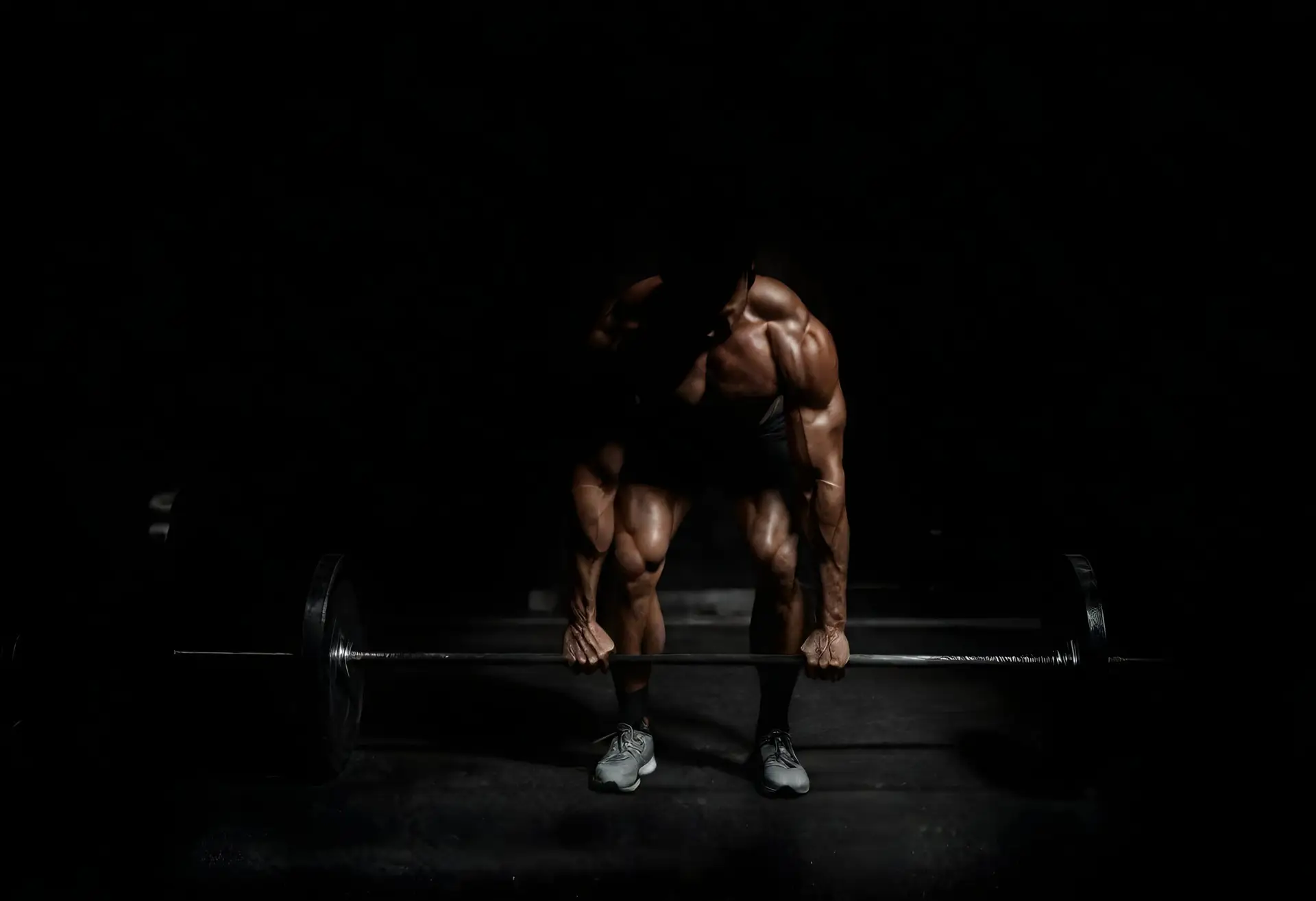 man-lifting-barbell-with-words-dumbbell-back